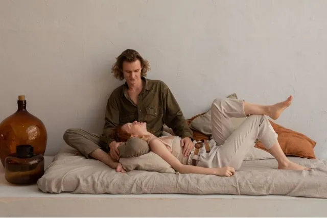 Cancer and Taurus couple relaxing together at home, symbolizing emotional security, loyalty, lasting affection, and the stable compatibility between the Water and Earth signs.