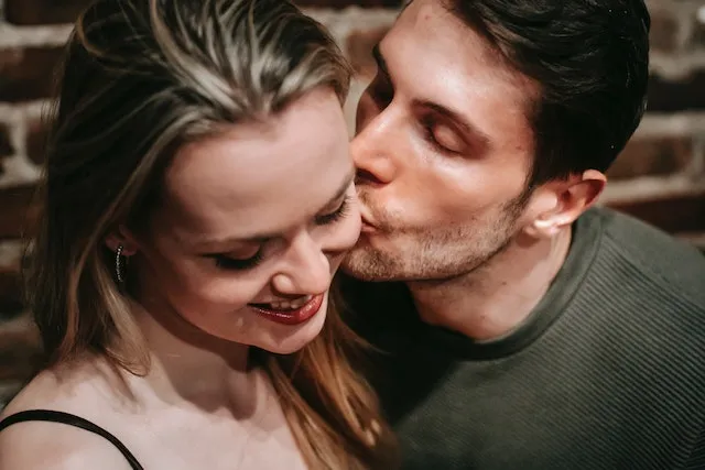 A Gemini and Sagittarius couple sharing a warm, affectionate moment, representing their adventurous spirit, open communication, and natural compatibility.