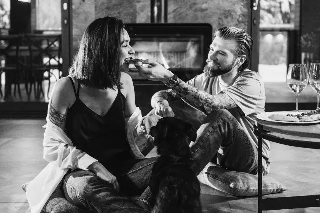 A Gemini and Aquarius couple enjoying a relaxed, affectionate moment together, symbolizing their intellectual connection, mutual understanding, and harmonious relationship.