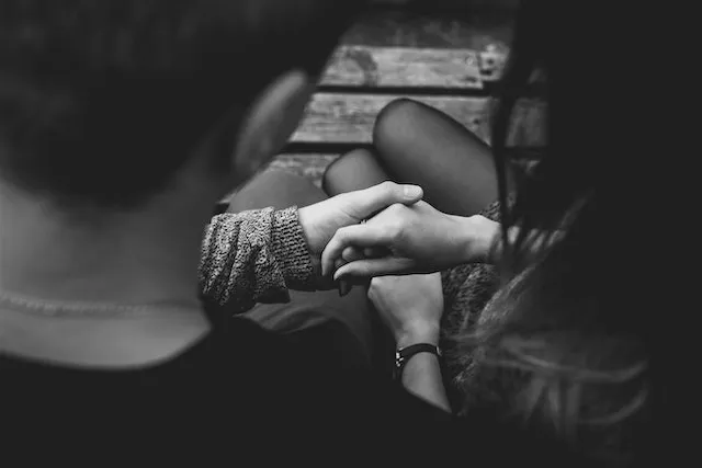 Couple holding hands, symbolizing Leo's romantic compatibility, loyalty, passion, and devoted relationships.